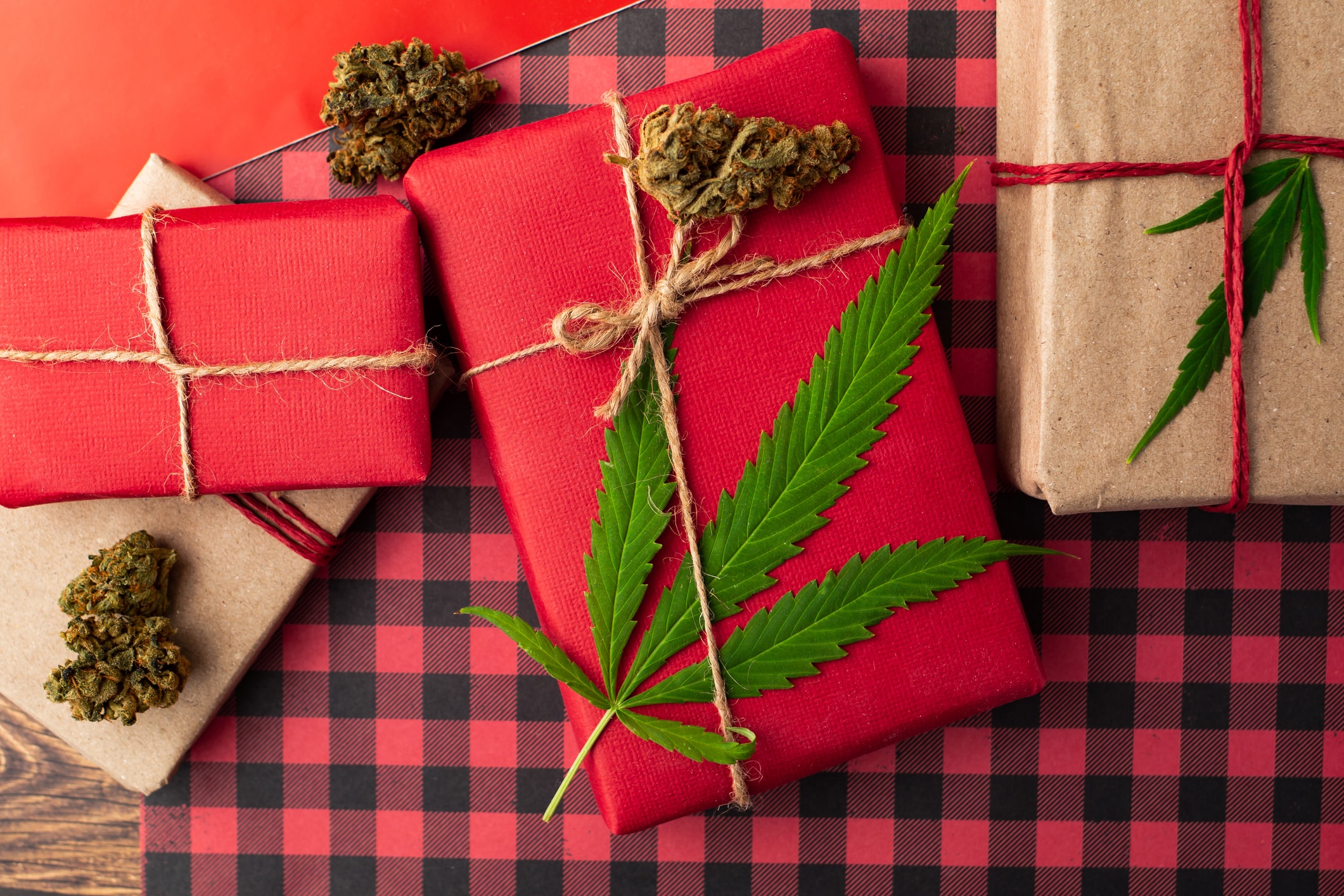 Red Christmas presents with cannabis leaf